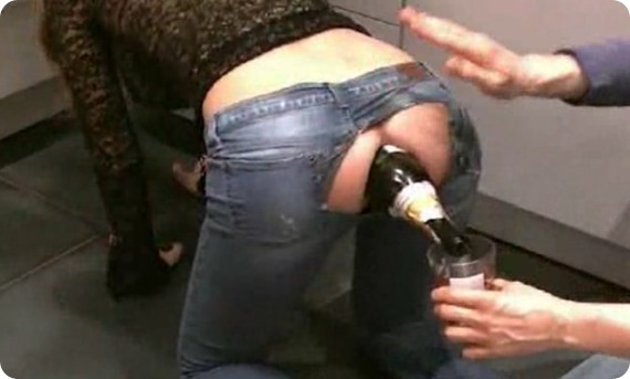 chick pours champagne out of her asshole